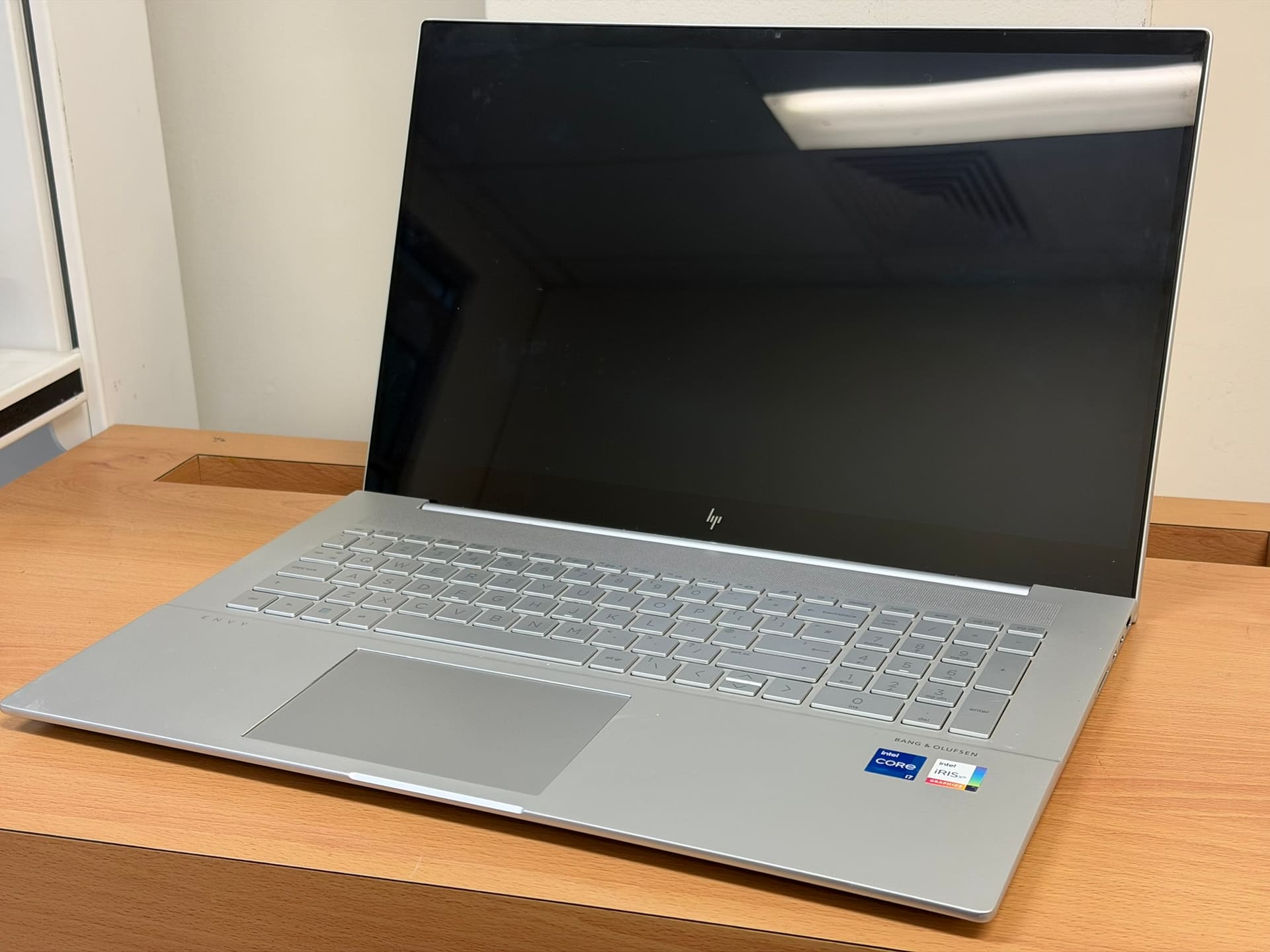 HP Envy laptop open on the bench in our Perth workshop